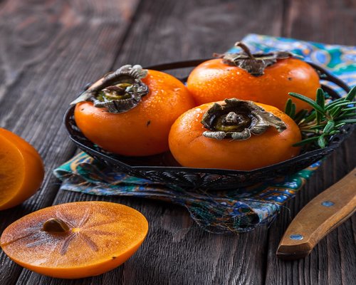 Fresh tropical fruits on a wooden table